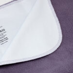 Washing Instructions on back of the banana passion waterproof blanket