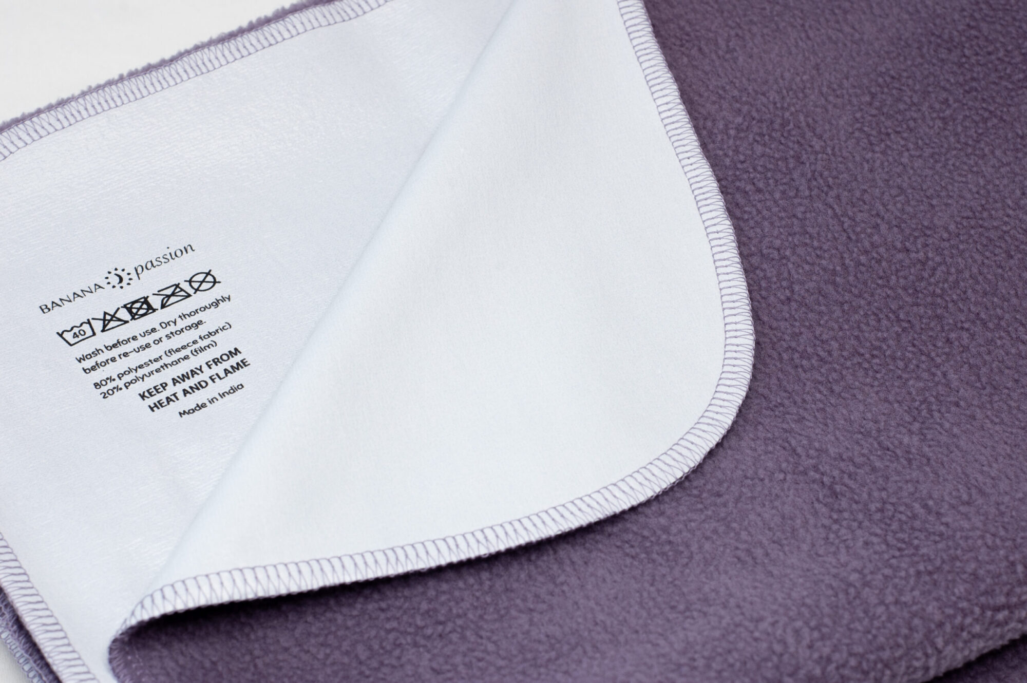 Washing Instructions on back of the banana passion waterproof blanket