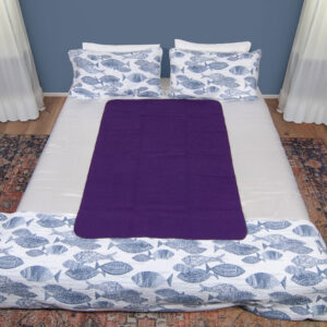 Dark Purple Waterproof Sex blanket on a white bed with fishes cover