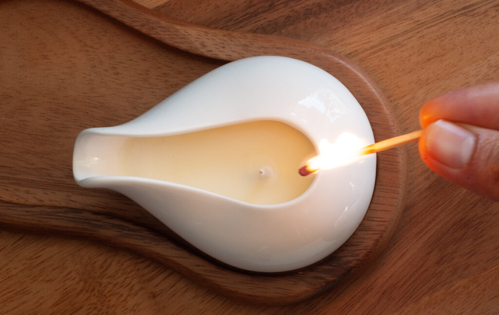 Purple Waterproof Blanket in the hands of a woman showcasing it is soft. This is exactly like squirt blanket or liberator throw. Best squirt blanket.