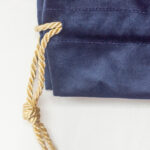 Blue Santa Sack Velvet fabric shows a twisted rope sewn inside the seem