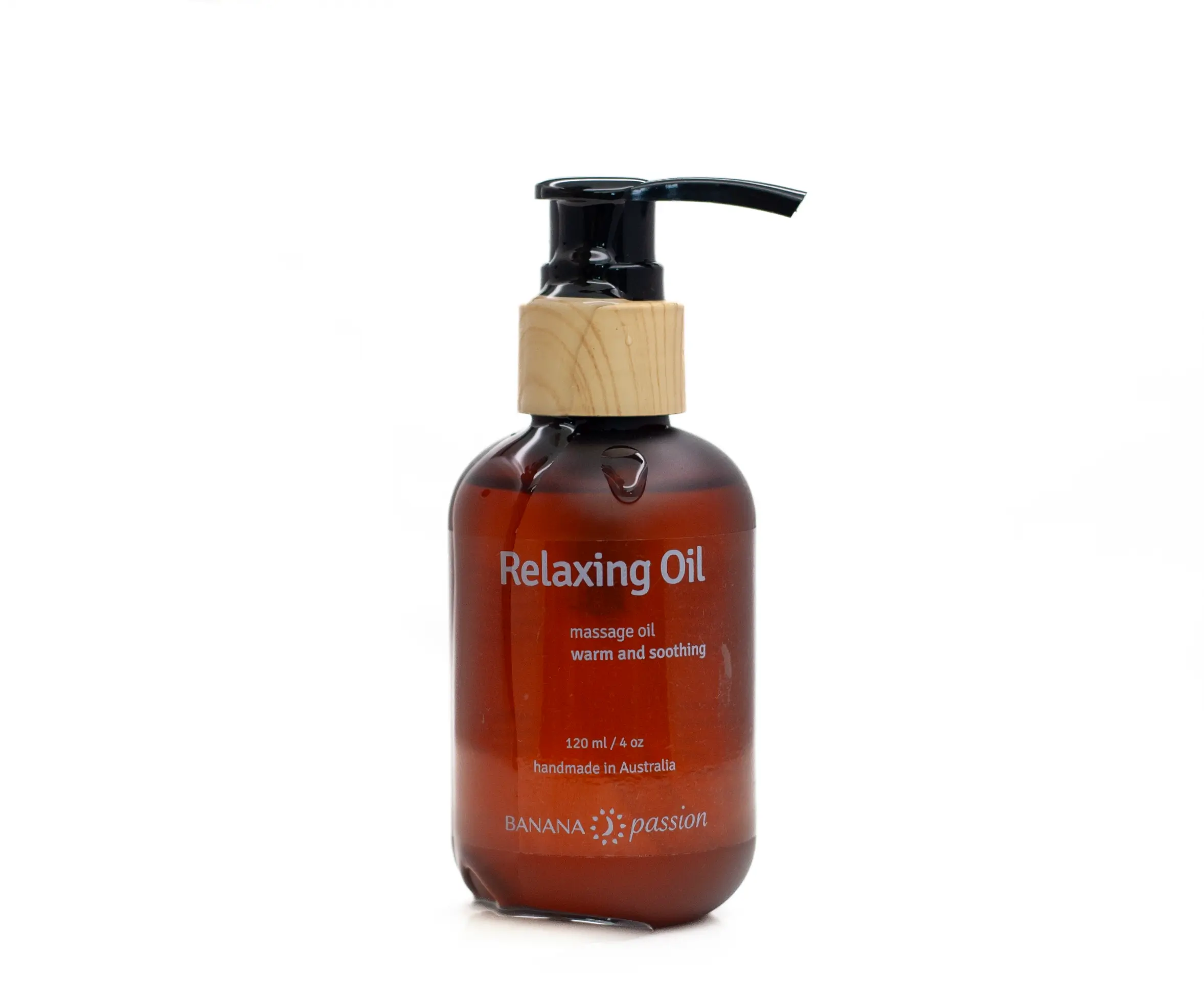 Relaxing massage oil which is warm and soothing. There is some oil being poured on the bottle. It is a 120ml bottle from Banana passion brand