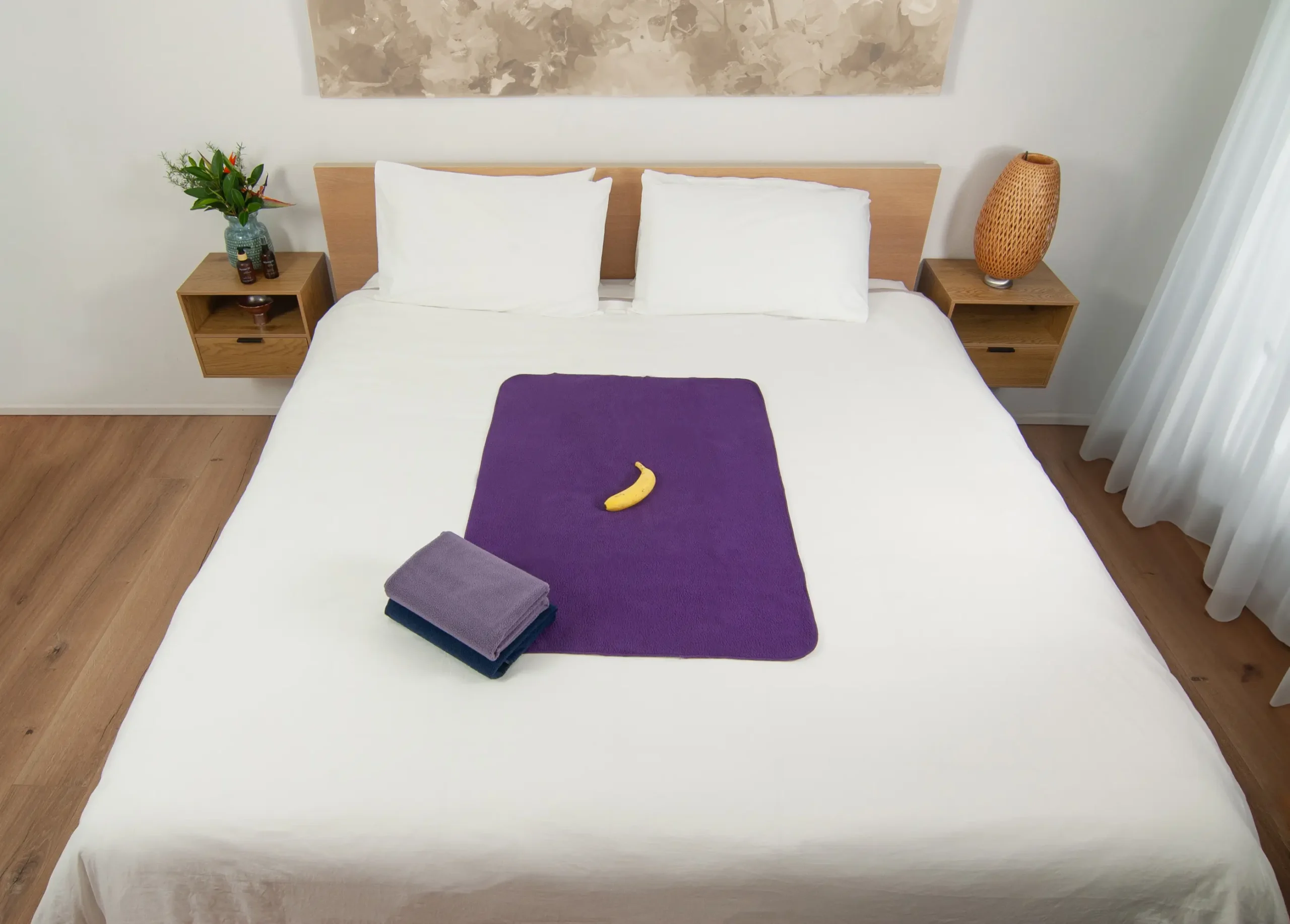 Dark Purple Waterproof Sex blanket on the bed with two other waterproof blankets next to it. These waterproof splash sex blankets are grey, and navy blue in colour. Splash blankets, sex blankets, waterproof blankets, these are some of the names used for our absorbent sex sheets.