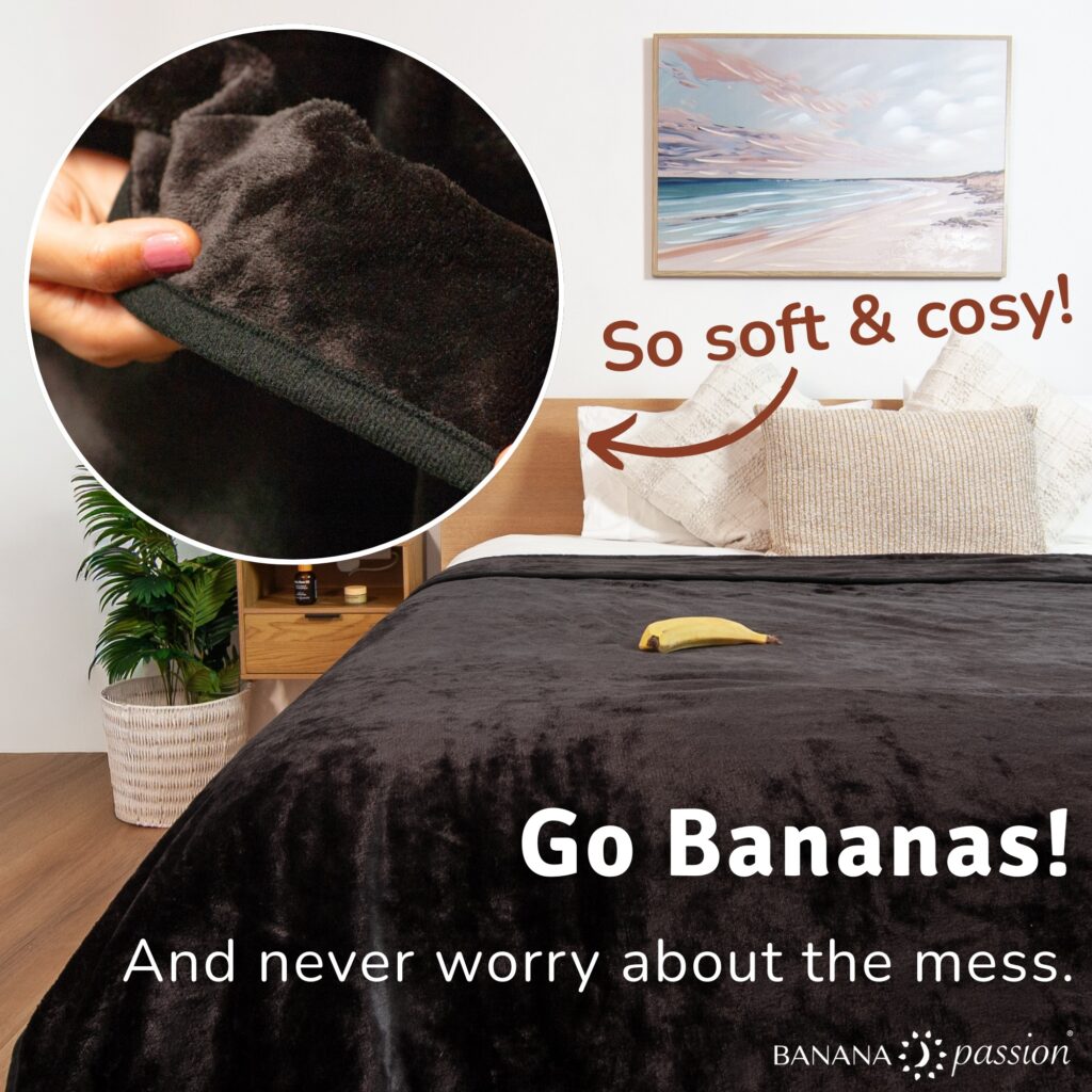 Banana Passion black waterproof blanket on a neatly made bed with the words “Never worry about the mess” highlighting stress-free intimacy and easy clean-up.