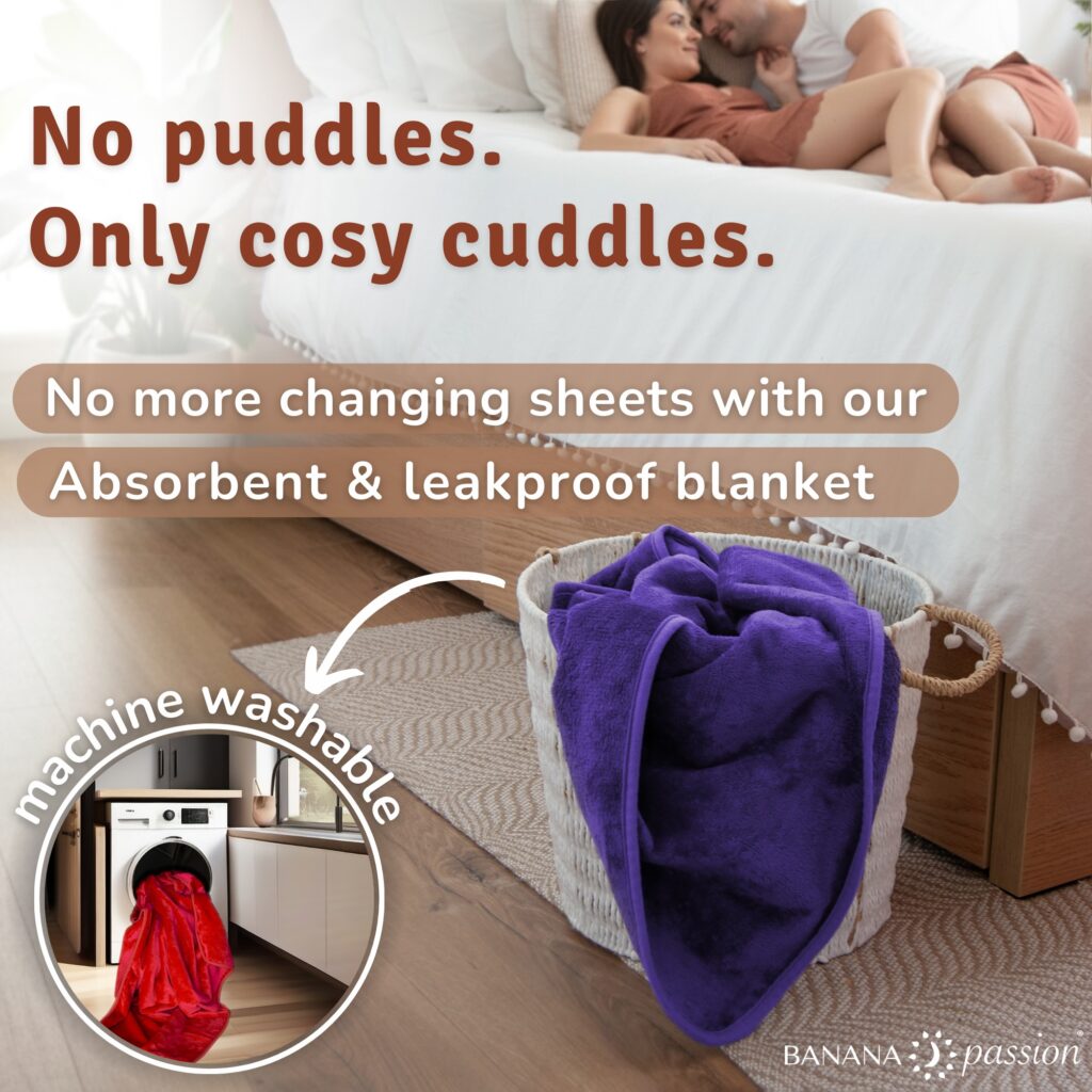 Couple playing on a bed with a Banana Passion waterproof blanket and the message “Never worry about the mess” highlighting stress-free intimacy.