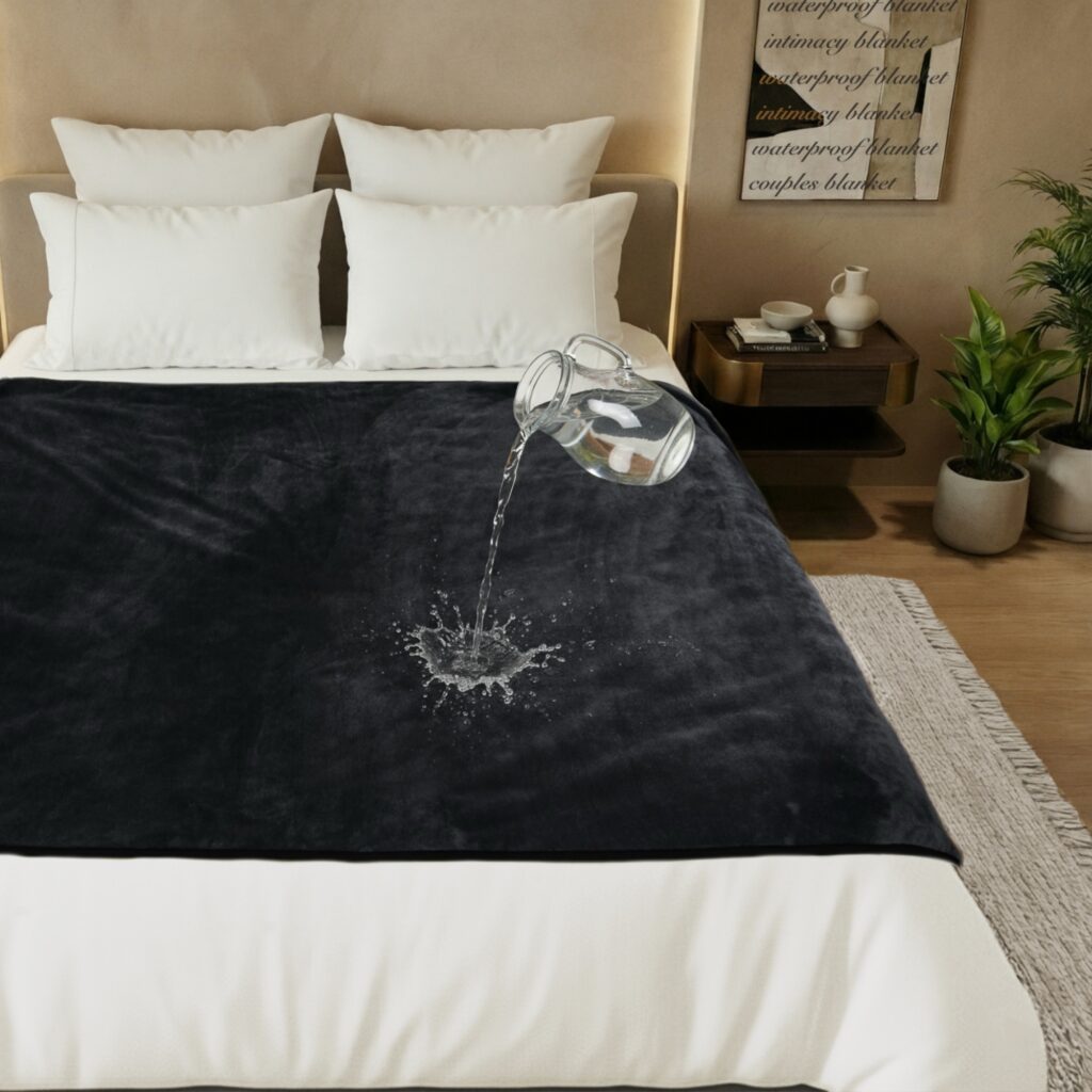 Purple waterproof blanket with water being poured onto the surface to show it stays dry underneath.