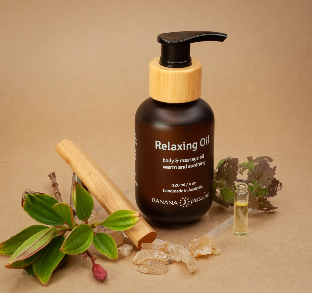 Banana Passion Relaxing Massage Oil ingredients—natural essential oils from various woods. Warm, soothing oil for relaxation, muscle relief, stress release, body wellness, and comforting couples massage.