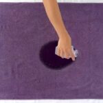 Water poured onto and getting absorbed on a quickdrying blanket