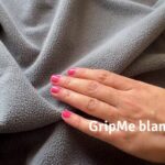Showing the soft polar fleece, non-slip backing, and its ability to absorb a lot of liquid but leaving the bed underneath dry